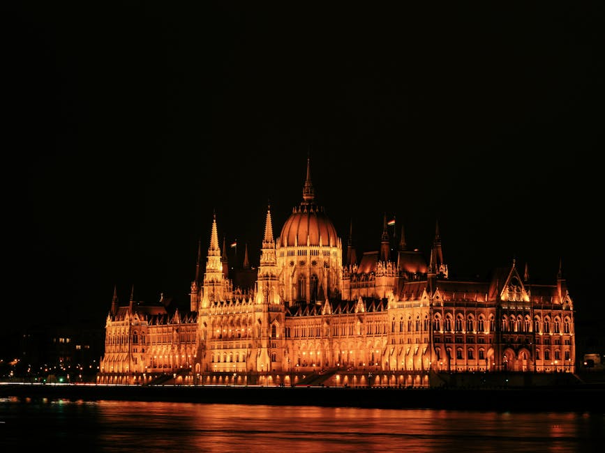 Stunning night view of Budapest's Parliament illuminated by warm lights along the Danube River