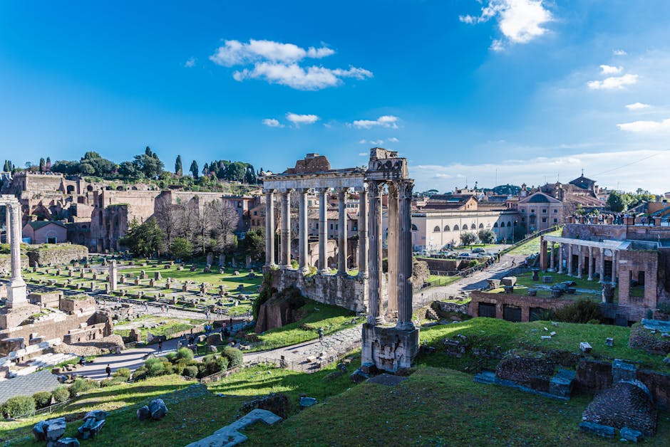 Explore the historic ruins of the Roman Forum in Rome, Italy, under a clear blue sky